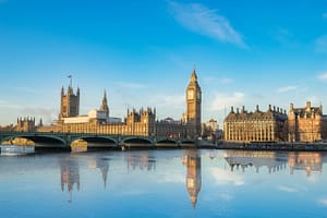 Big Ben And Westminster Parliament With Colorful Sky And Water